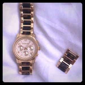 Michael Kors tortoise shell watch.